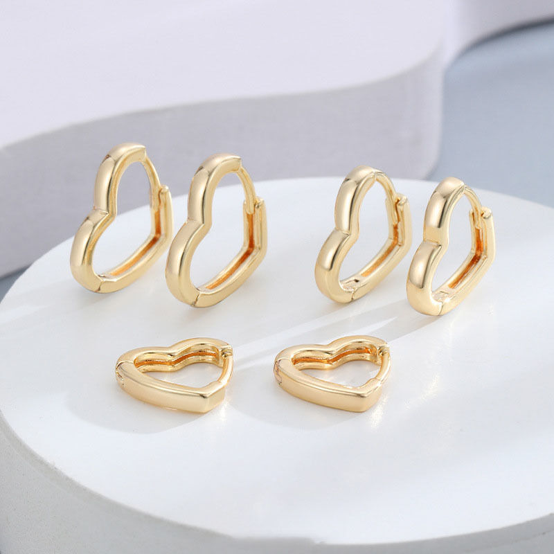 Quality Wholesale Fashion 14K Gold Plated Smooth Heart Shaped Hoop Earrings Jewelry for Women 2026 Minimalist Brass Huggie Earring factory