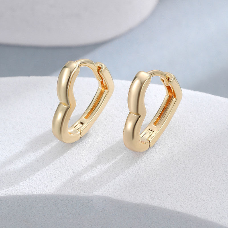 Quality Wholesale Fashion 14K Gold Plated Smooth Heart Shaped Hoop Earrings Jewelry for Women 2026 Minimalist Brass Huggie Earring factory